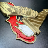 Army Pathfinder Badge display insignia in red, gold, and white finishes laid out on a black surface.