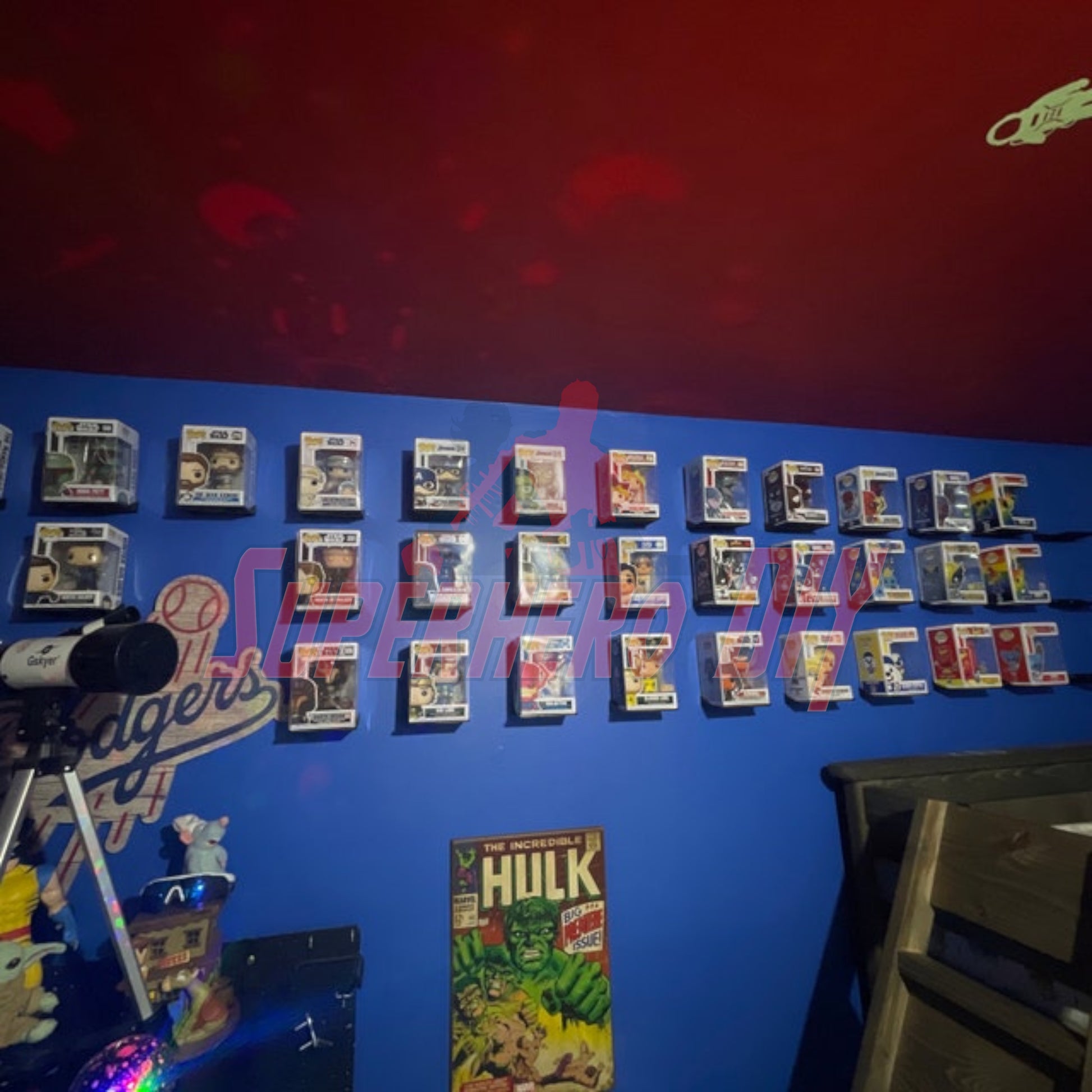 Wall-mounted hexagon Funko Pop display shelves showcasing collectible figures in protectors.