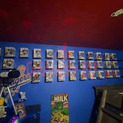 Wall-mounted hexagon Funko Pop display shelves showcasing collectible figures in protectors.