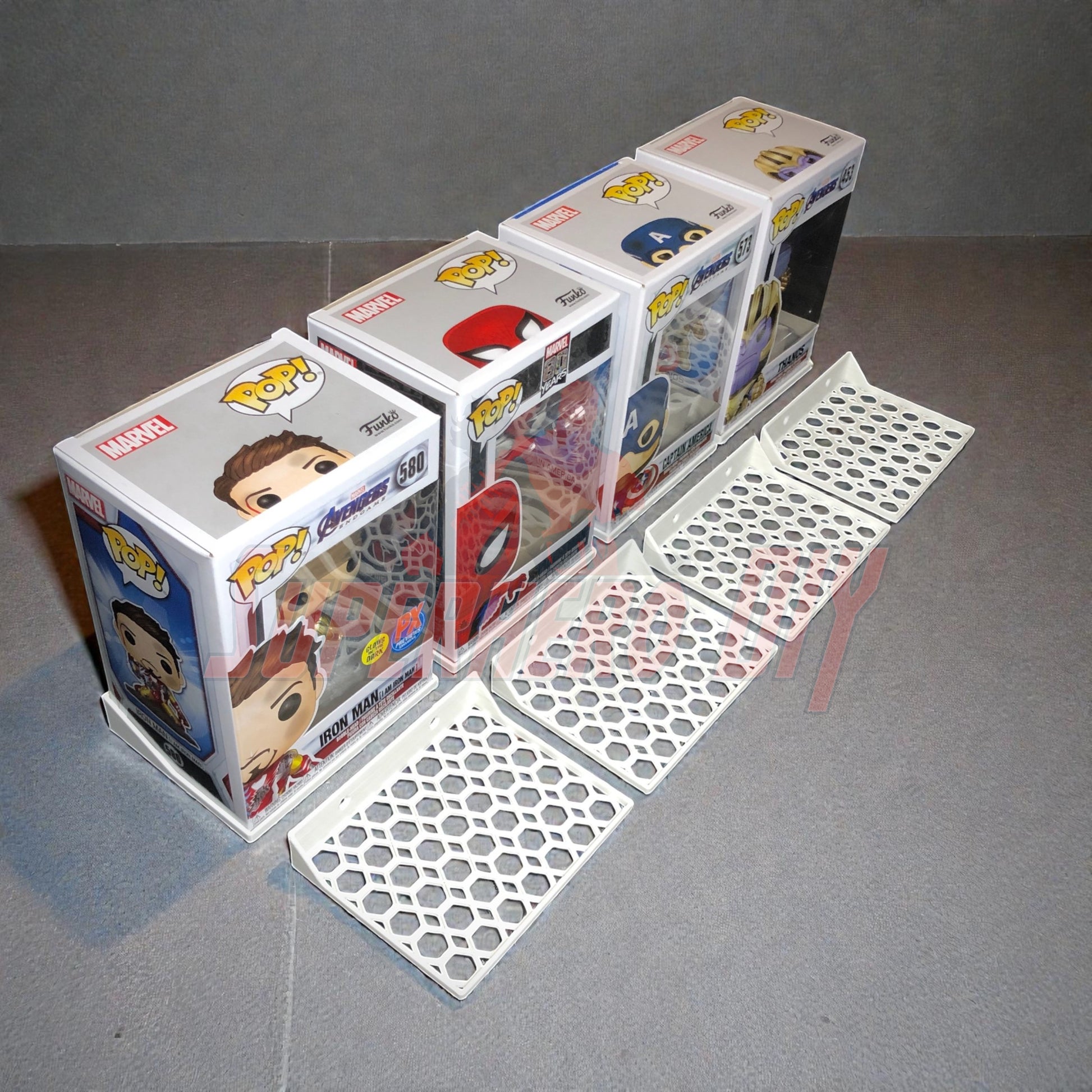 Hexagon Funko Pop display shelves with boxed collectibles on honeycomb base.