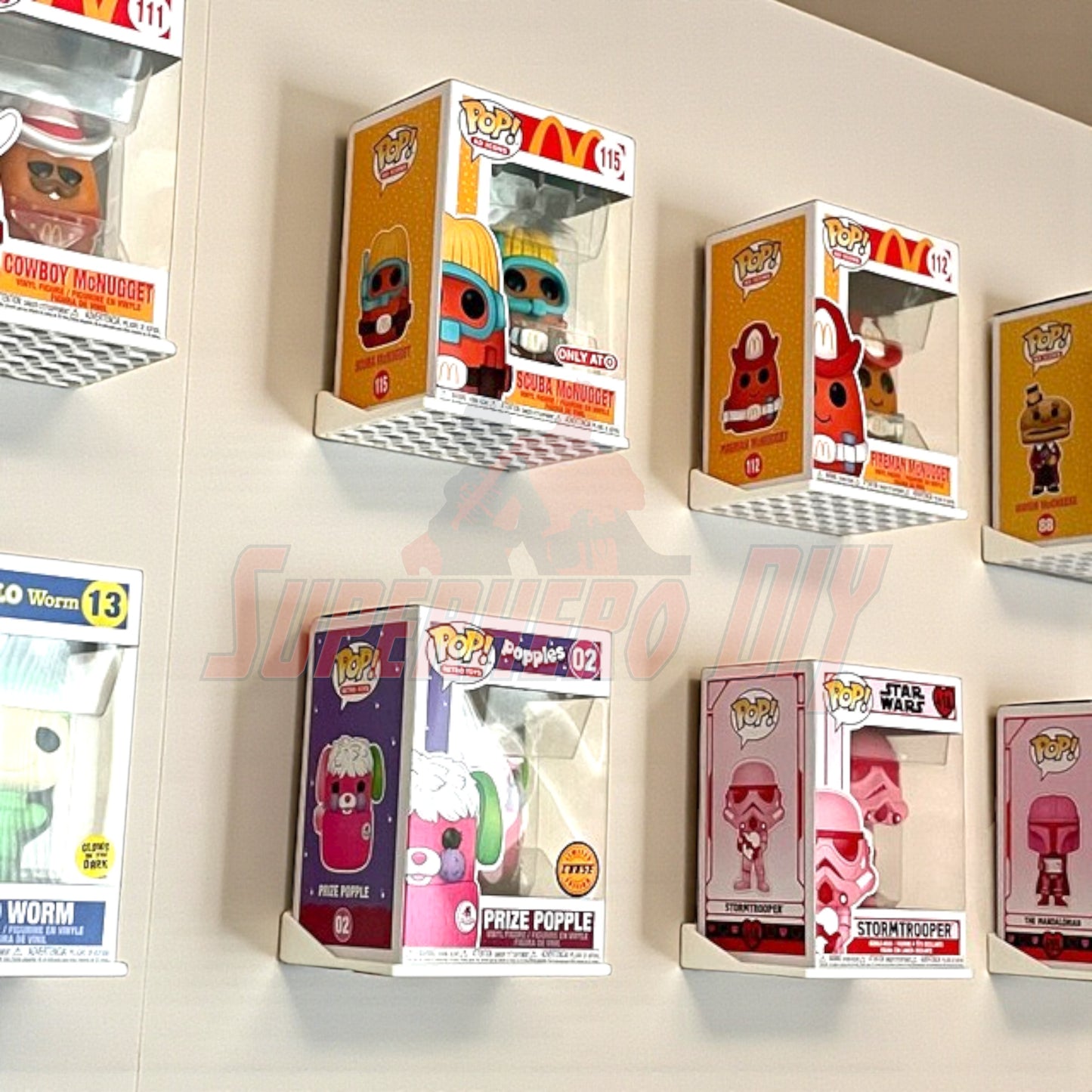 Wall-mounted hexagon Funko Pop display shelves with various collectible boxes for a neat, organized showcase.