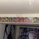 Hexagon Funko Pop display shelves showcasing boxed figures on wall-mounted floating shelf.