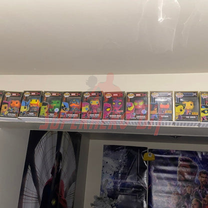 Hexagon Funko Pop display shelves showcasing boxed figures on wall-mounted floating shelf.