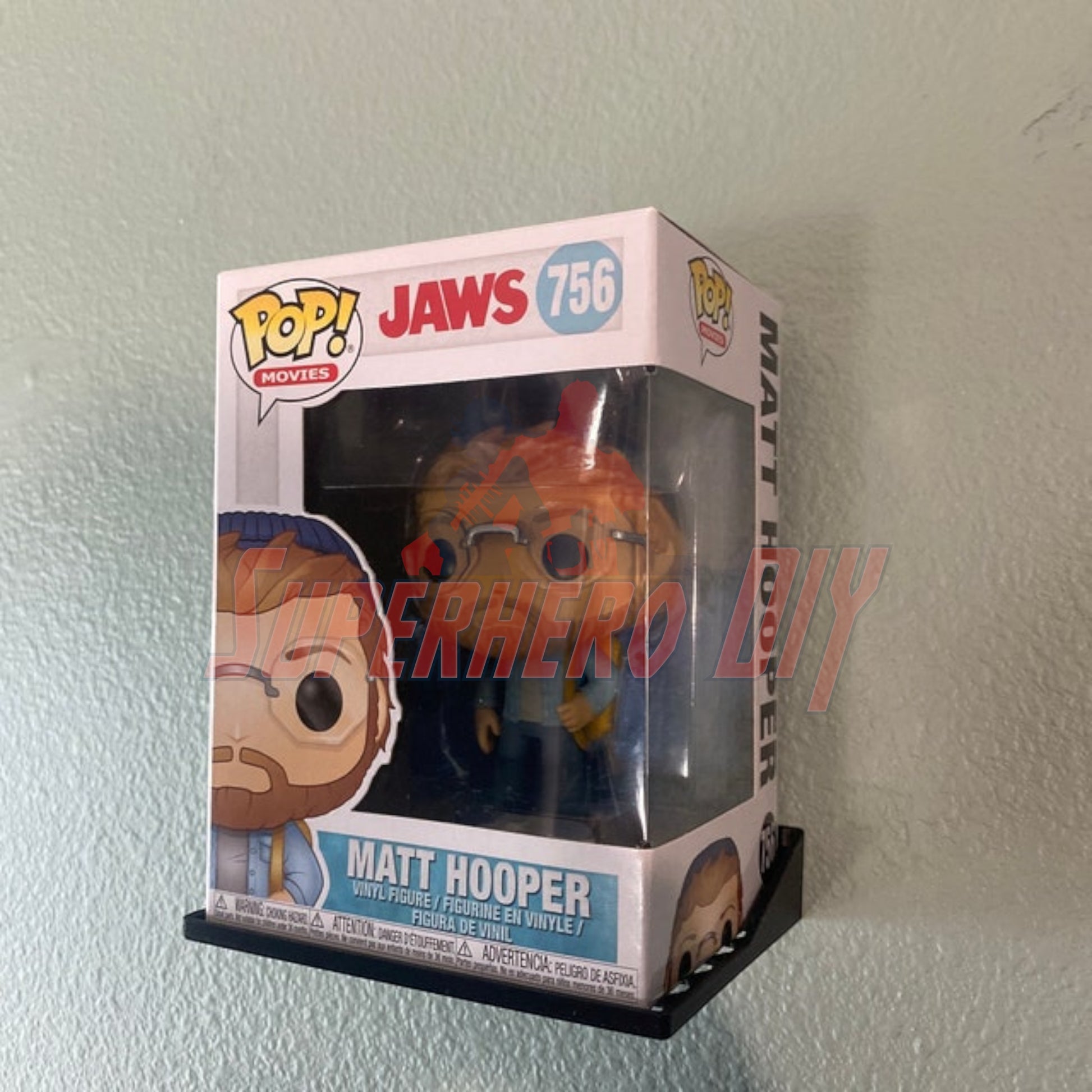 Hexagon Funko Pop display shelves showcasing Matt Hooper Jaws 756 figure in a soft or hard protector case.