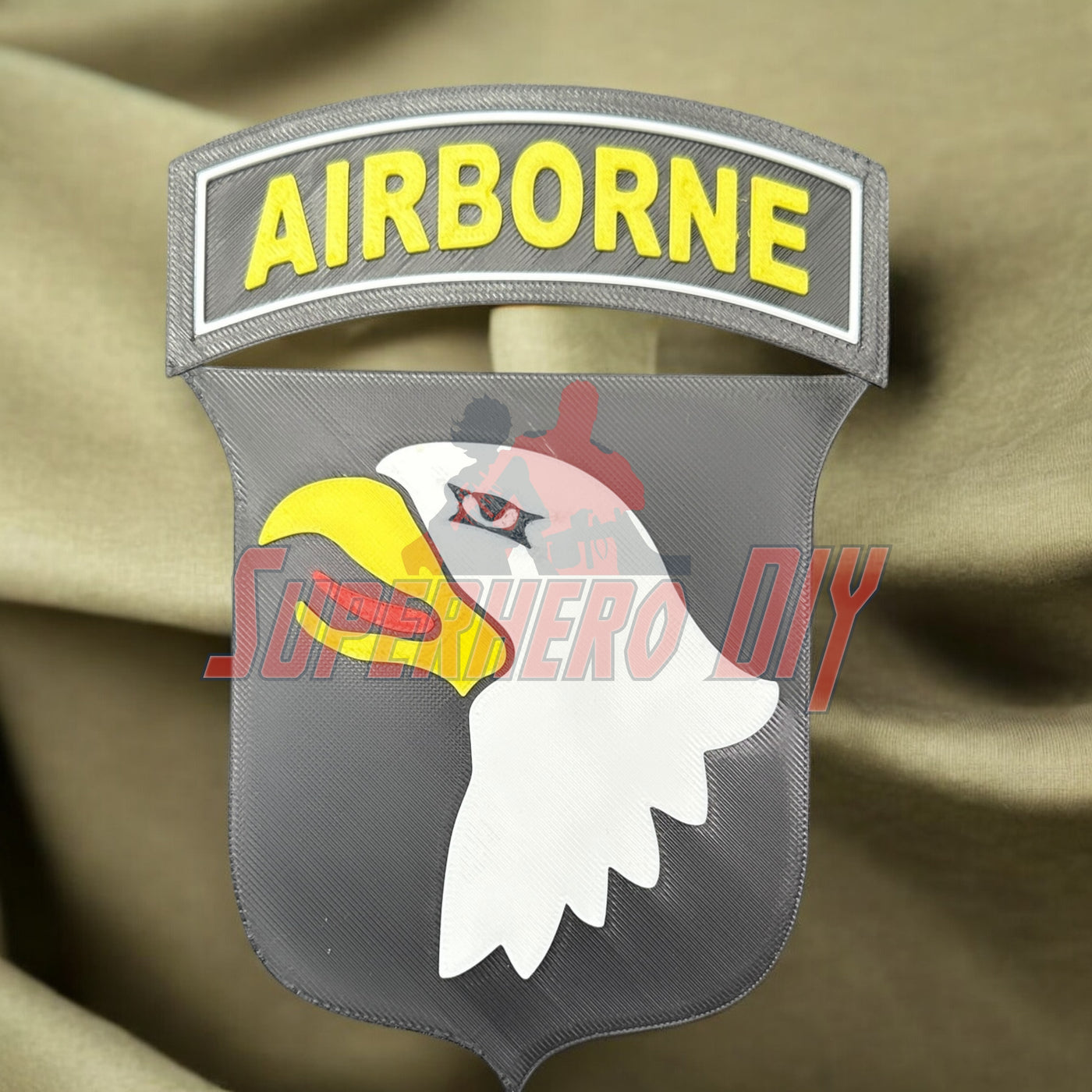101st Airborne Division display insignia on olive fabric background