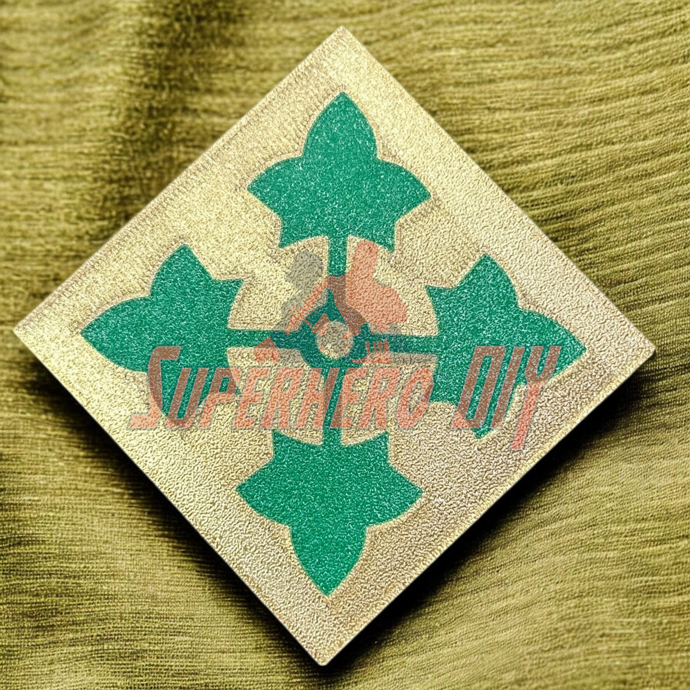 4th Infantry Division display insignia with ivy leaf design on a textured background