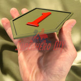 Hand holding 3D-printed 1st Infantry Division display insignia, Big Red One patch for wall display or shadowbox