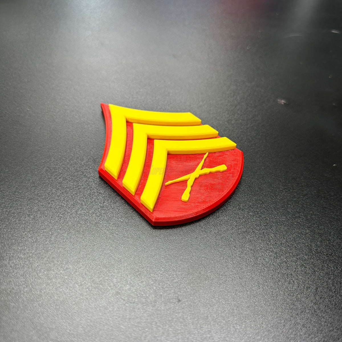 USMC enlisted rank insignia in red and yellow, showcasing the rank of Sergeant in 3D-printed design.