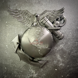 Marine Corps EGA wall display, rope-wrapped anchor driving through the globe