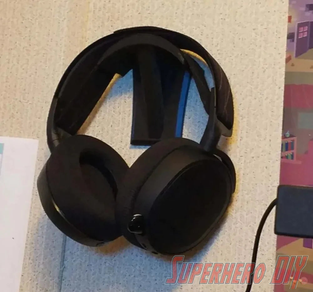 Check out the Wall Mounted Headphone Stand | No screws no drilling and fits most headphones | Mount with included Command strips from Superhero DIY! The perfect solution for only $8.99
